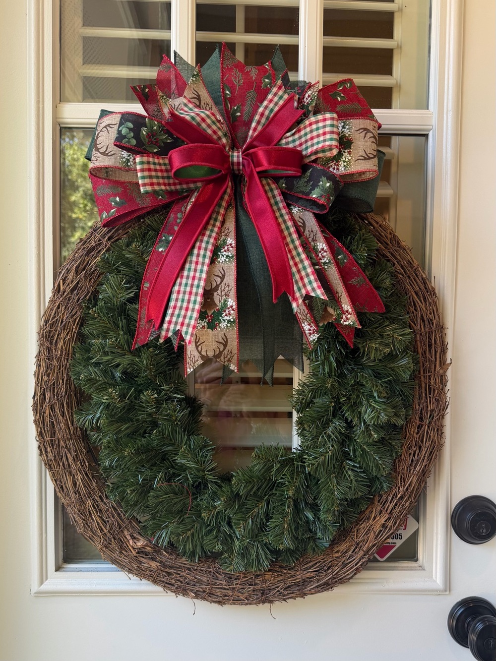 Traditional Green Holiday Wreath with Red Ribbon Bow